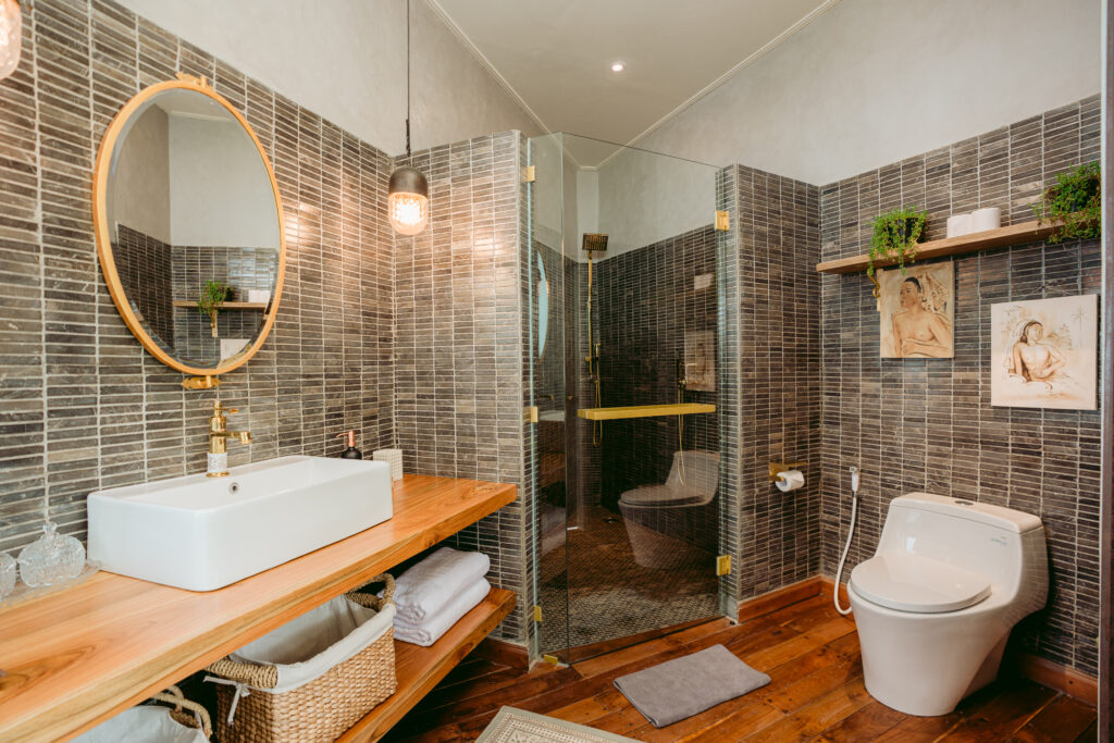 Elegant Bathroom with Natural Stone and Wooden Design at The Little Hill Suite